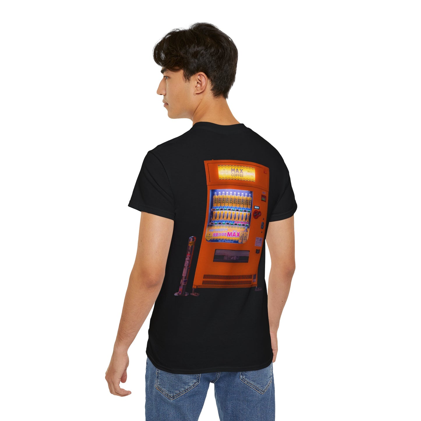 A black t-shirt featuring a graphic print of a vintage coffe vending machine on a male model.