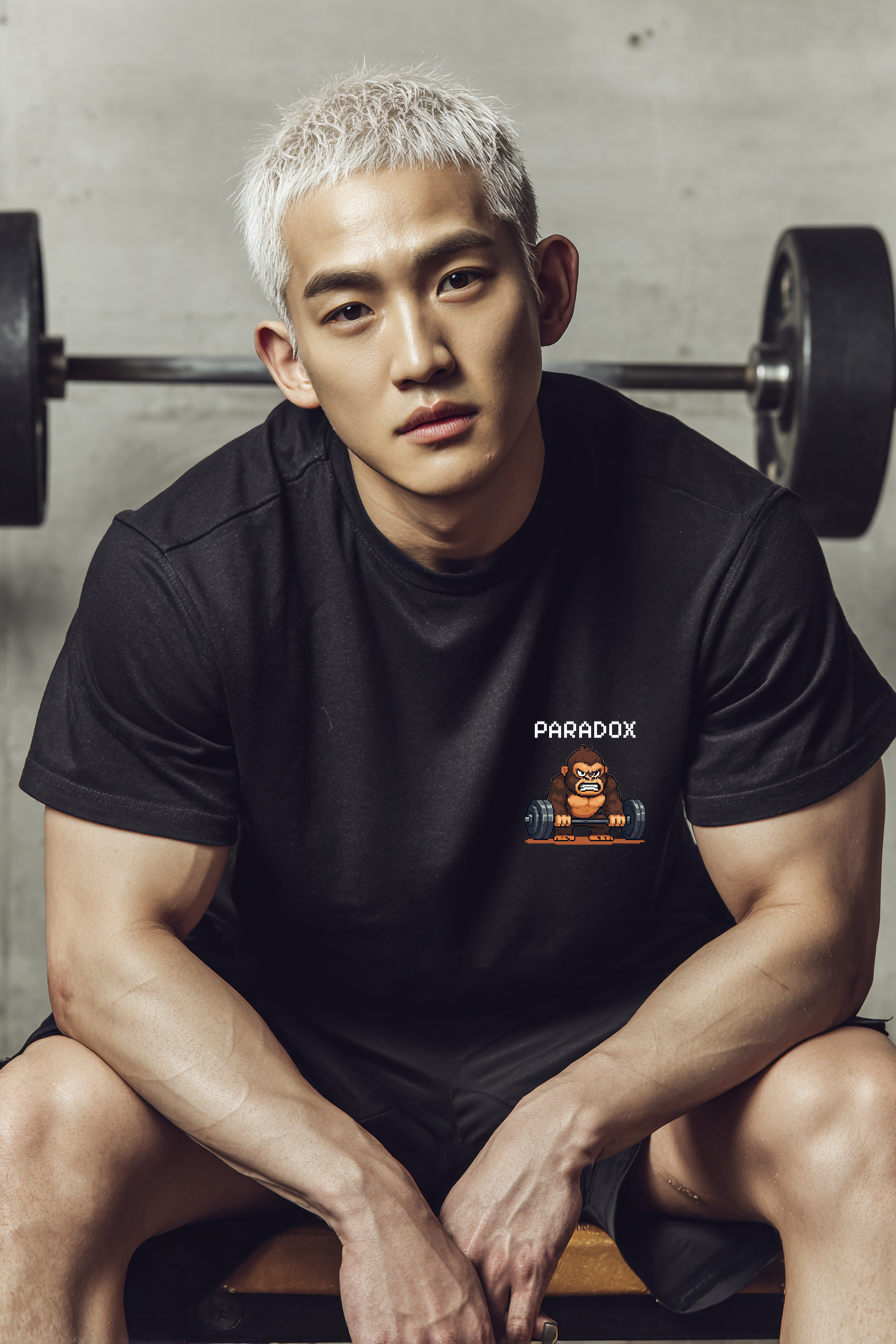 Black t-shirt with a graphic pixel art of gorilla in the gym on a male Korean model in the gym