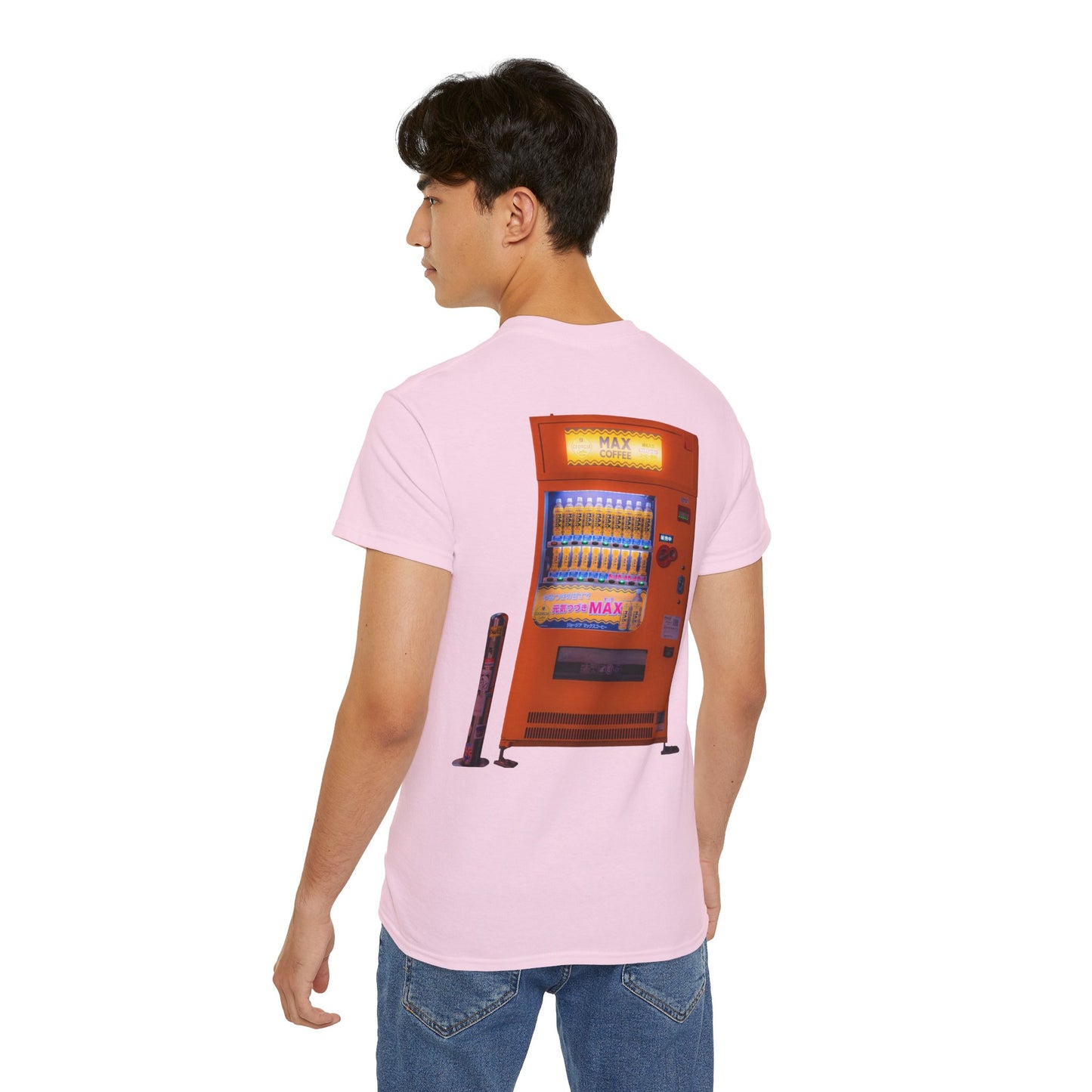 A pink t-shirt featuring a graphic print of a vintage coffe vending machine on a male model.