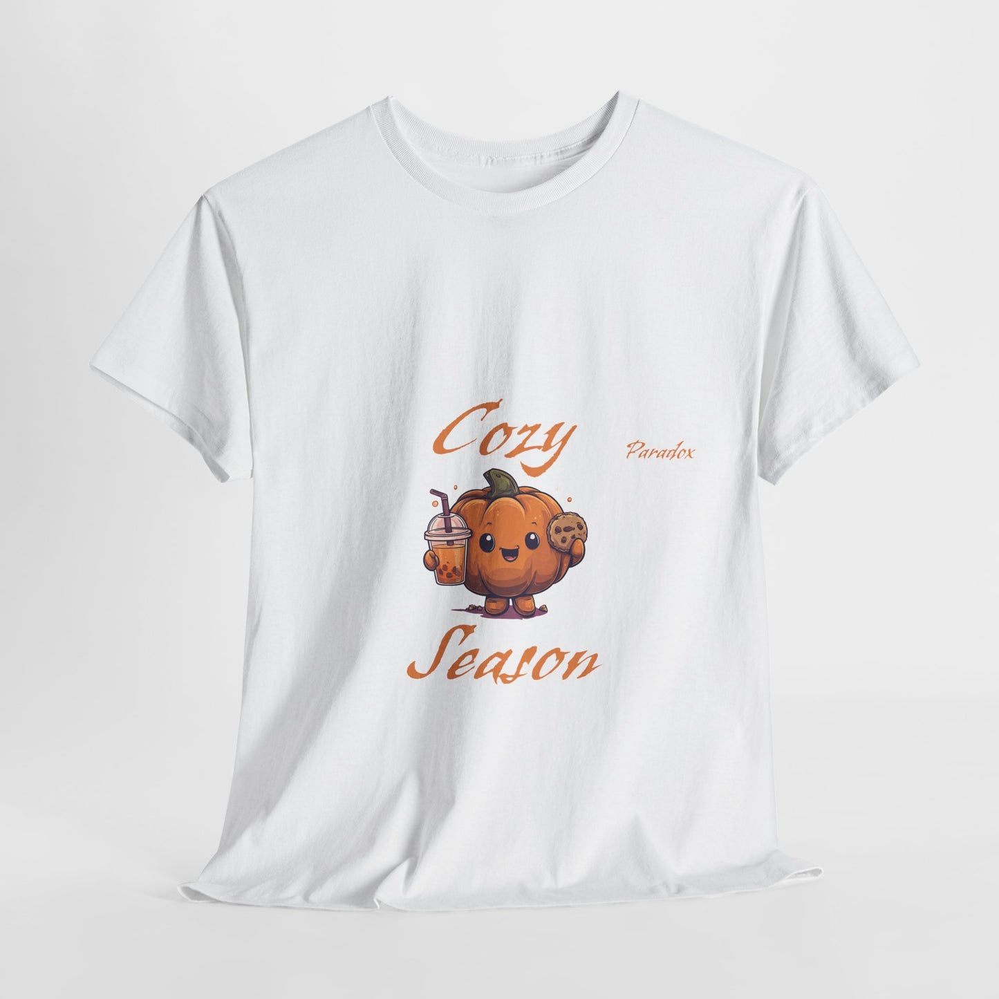 White t-shirt of a graphic cute cozy season pumpkin holding a cookie and pumpkin spice