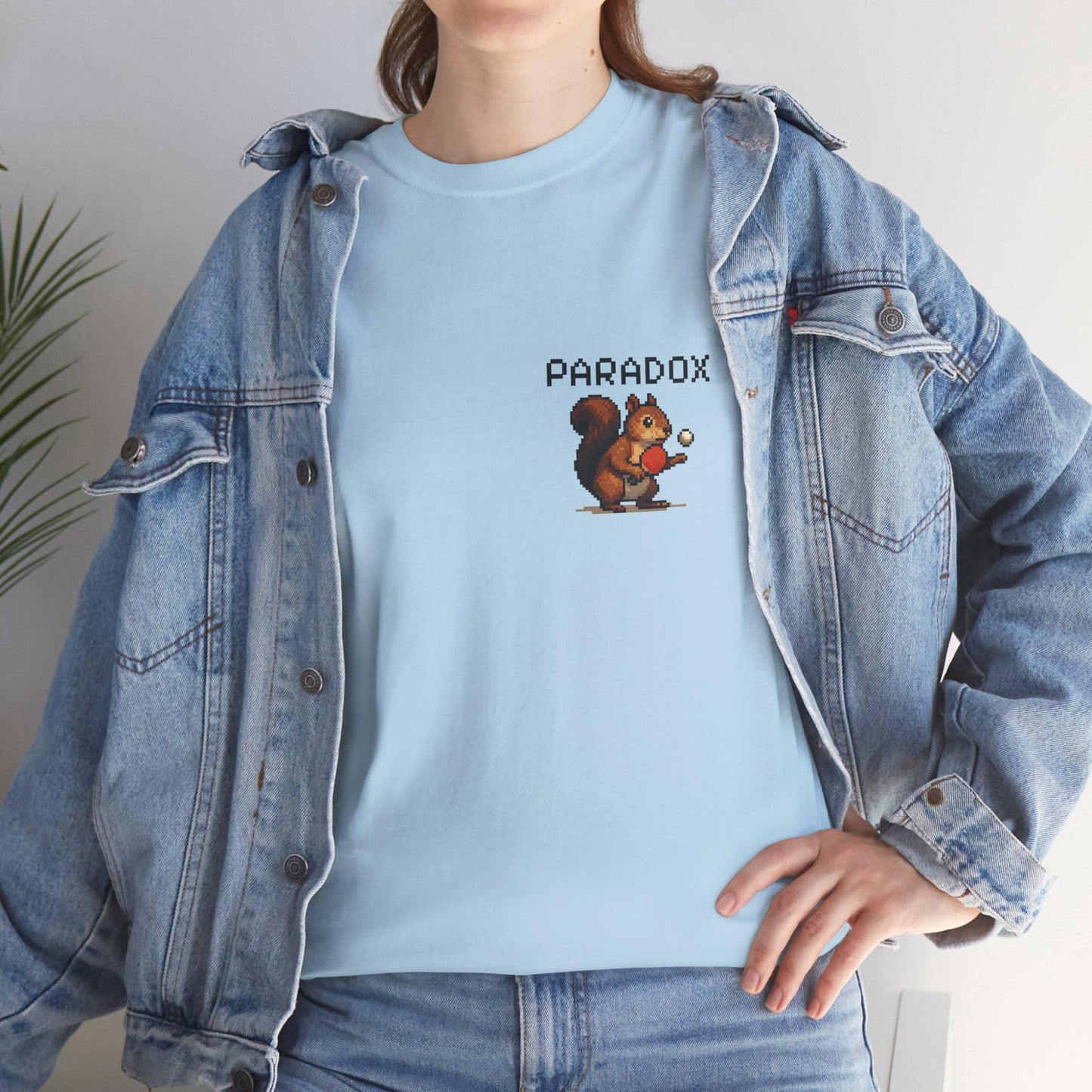 Blue t-shirt with a pixel graphic of a squirrel playing ping pong on a female model