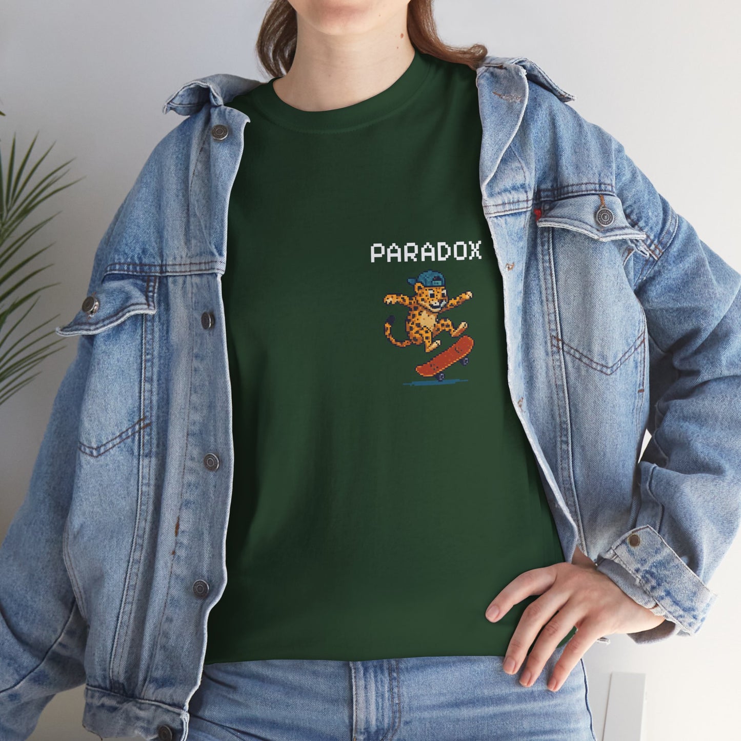 Green t-shirt with a pixel graphic of a leopard skateboarding backside on a female model