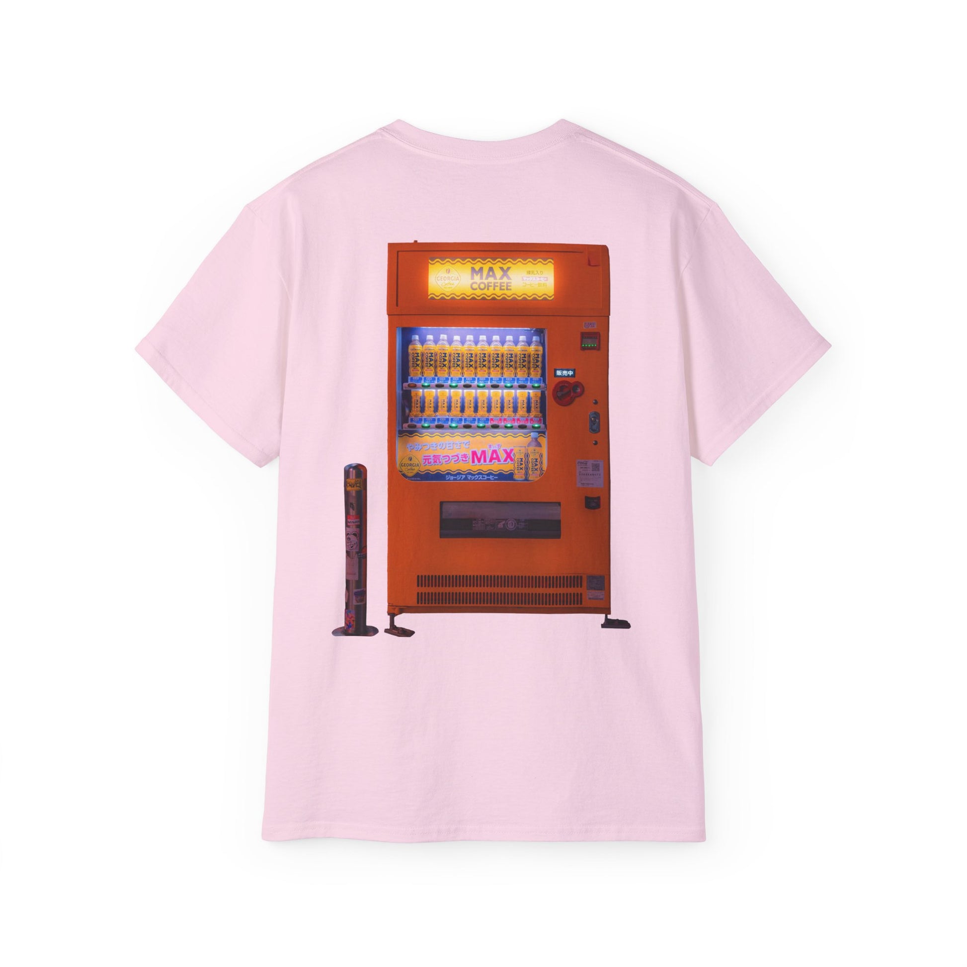 A pink-colored t-shirt featuring a graphic print of a vintage coffe vending machine.