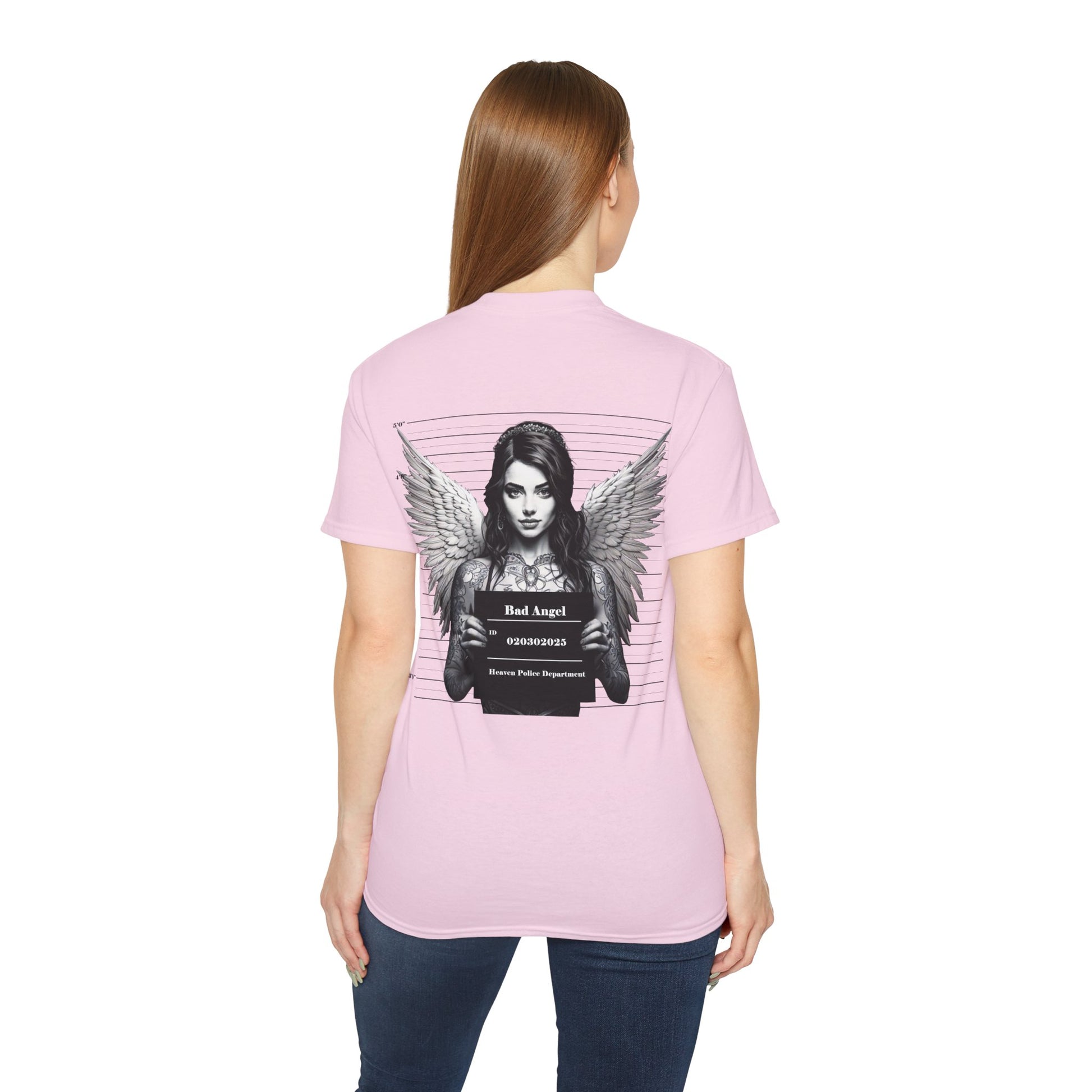 A pink t-shirt featuring a graphic print of a bad angel with wings, resembling a mugshot on a female model.