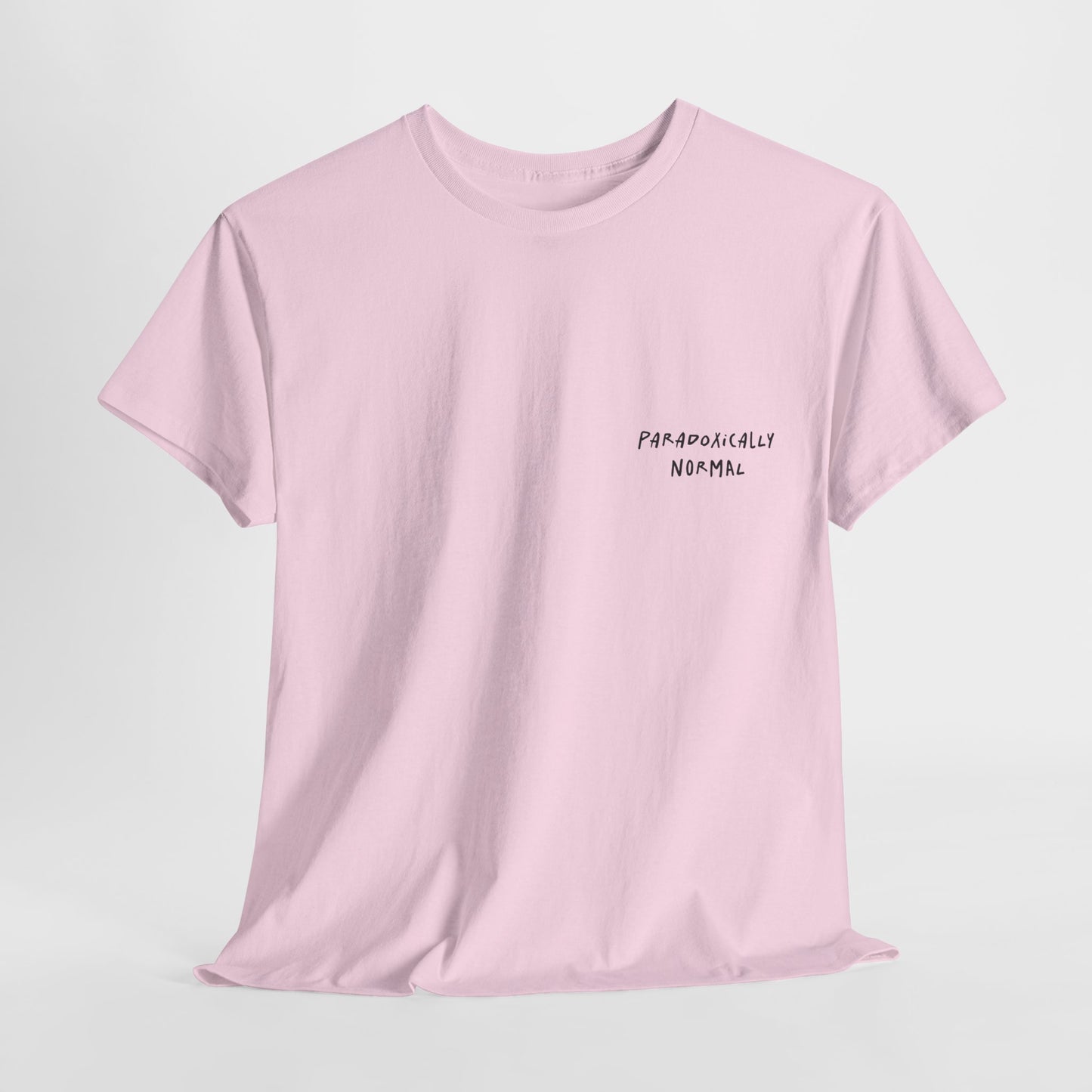 Pink t-shirt with a graphic of a text reading 'Paradoxically Normal' 