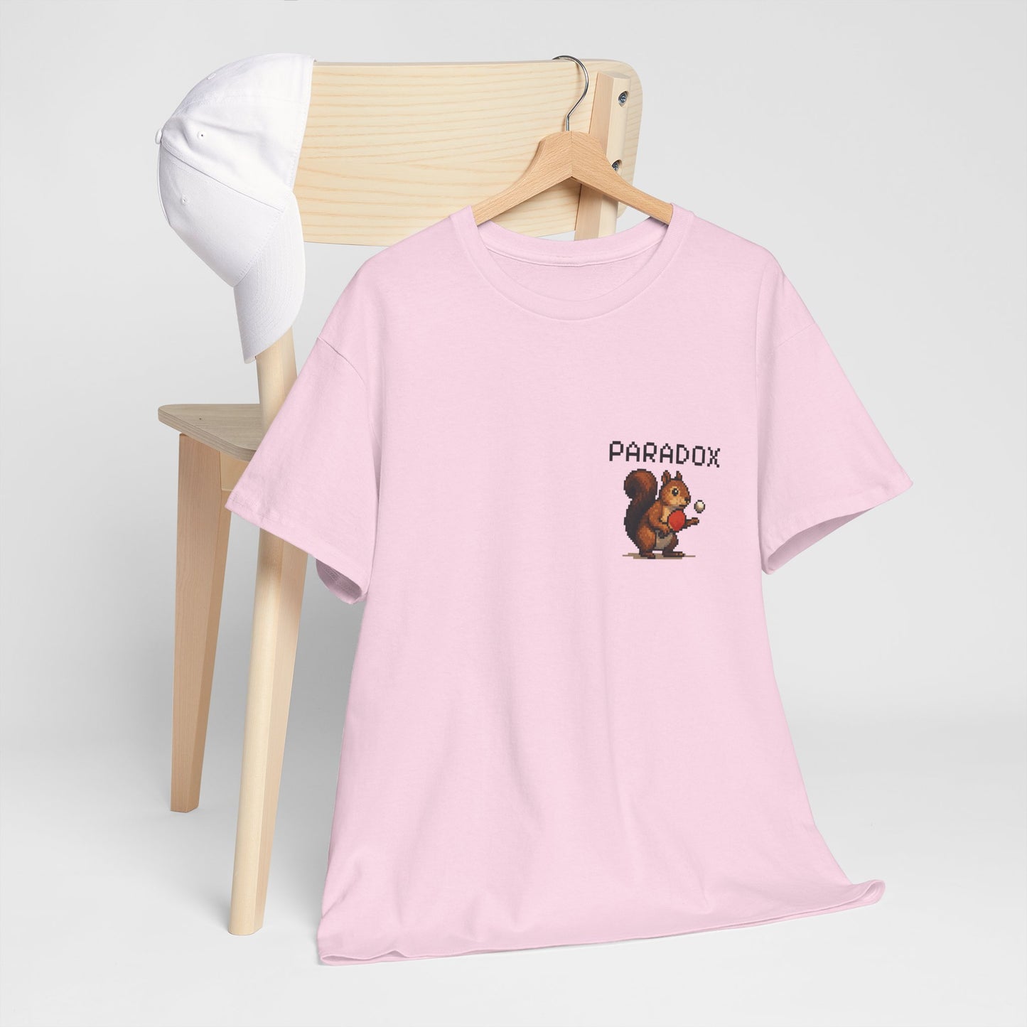 Pink t-shirt with a pixel graphic of a squirrel playing ping pong