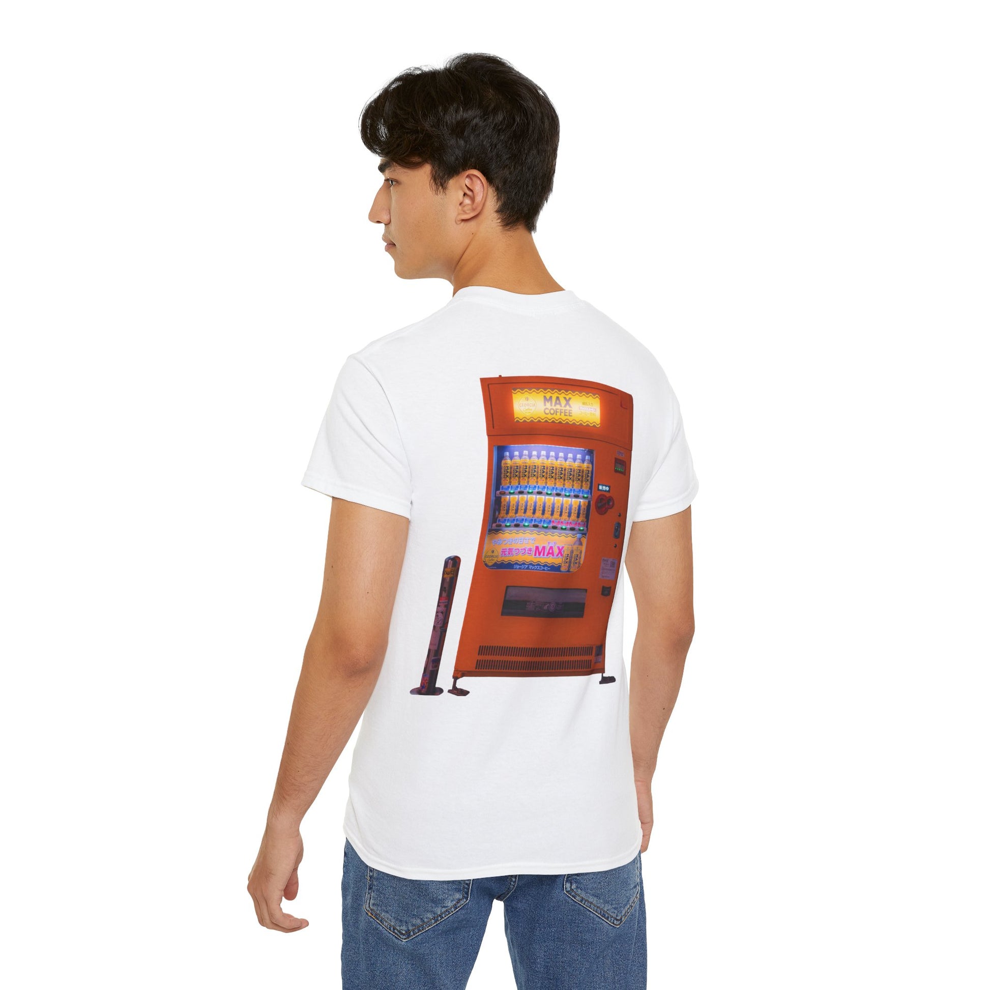 A white t-shirt featuring a graphic print of a vintage coffe vending machine on a male model.