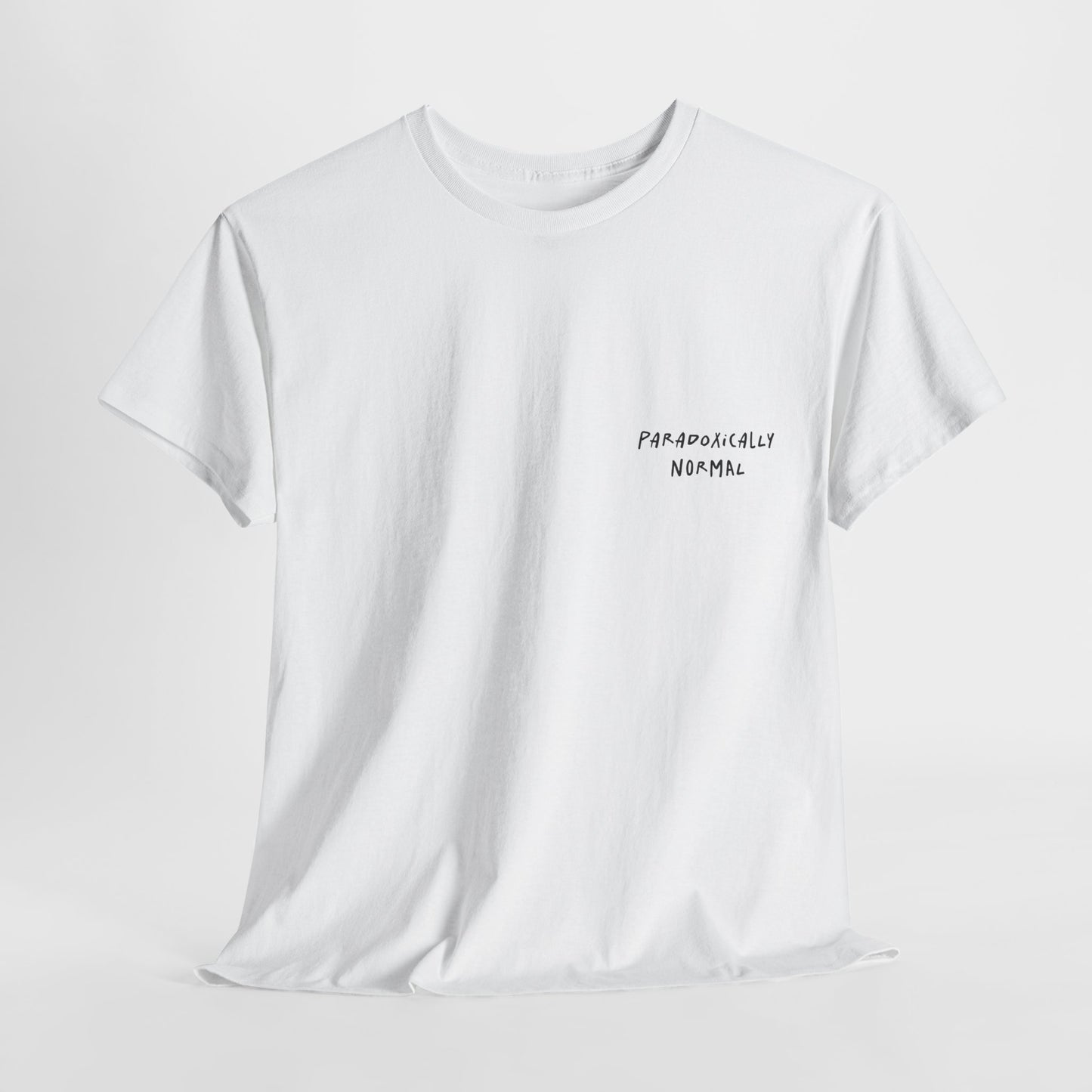 White t-shirt with a graphic of a text reading 'Paradoxically Normal' 