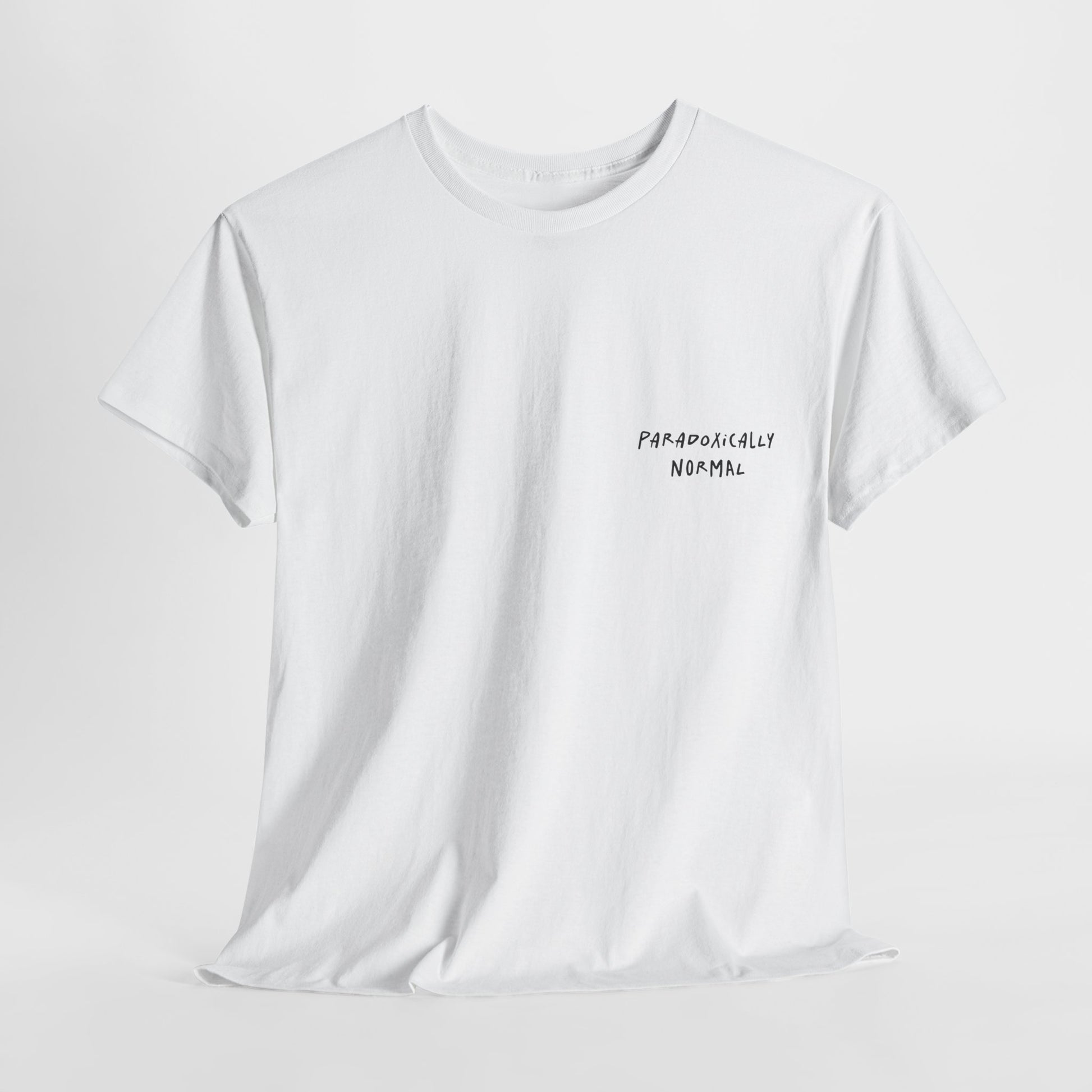 White t-shirt with a graphic of a text reading 'Paradoxically Normal' 