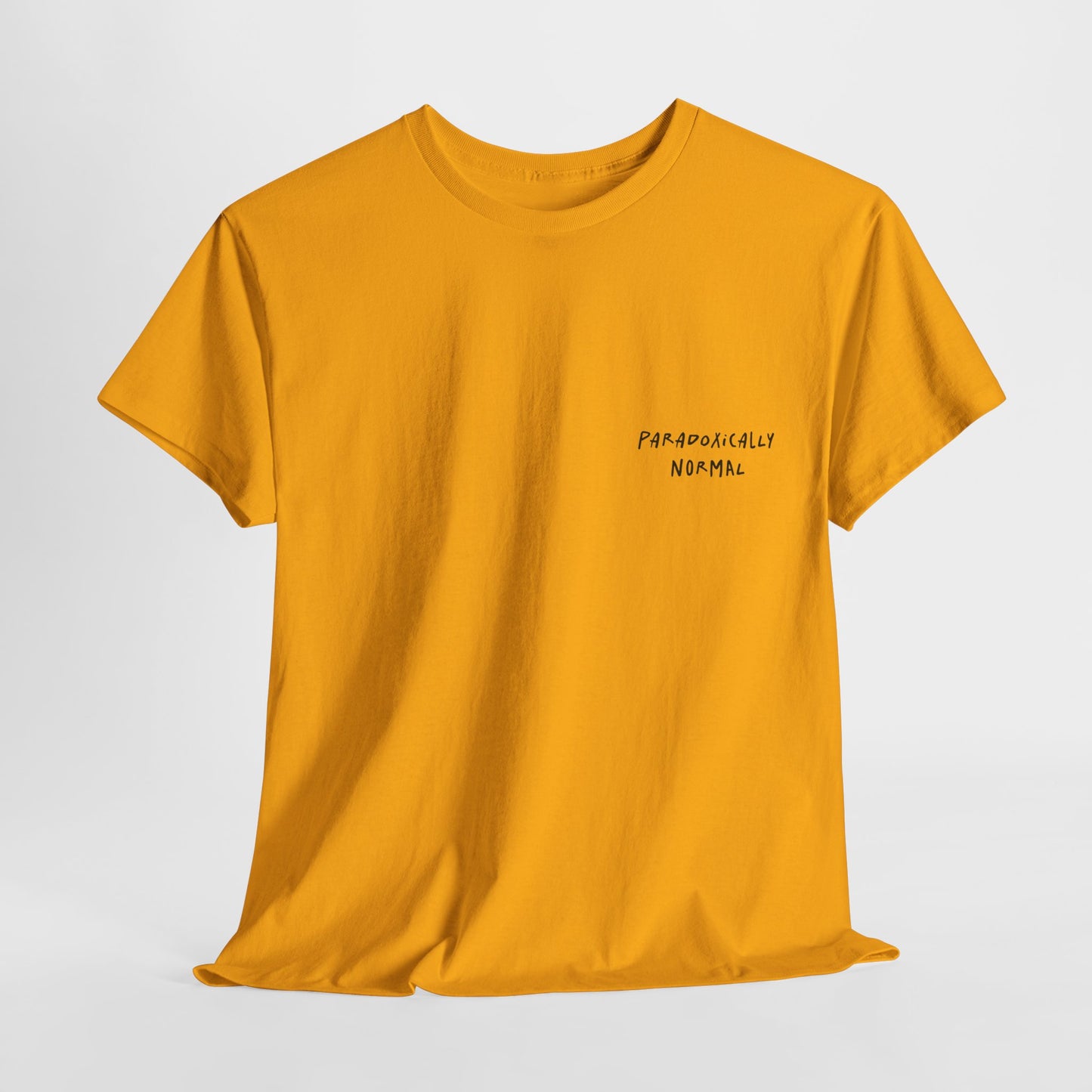 Yellow t-shirt with a graphic of a text reading 'Paradoxically Normal' 